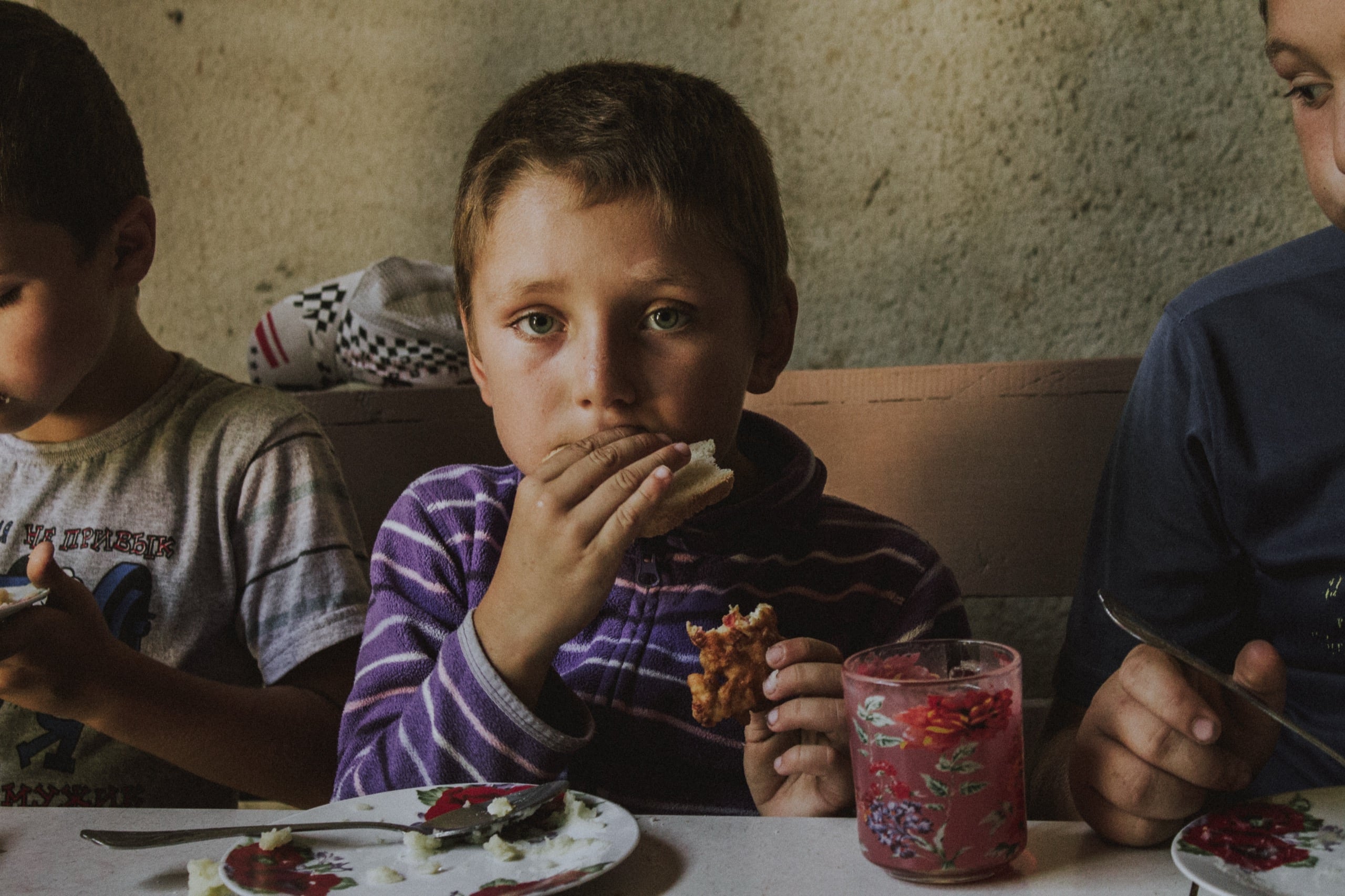 A child at the table in Moldova — every gift means a meal, a bed, a home